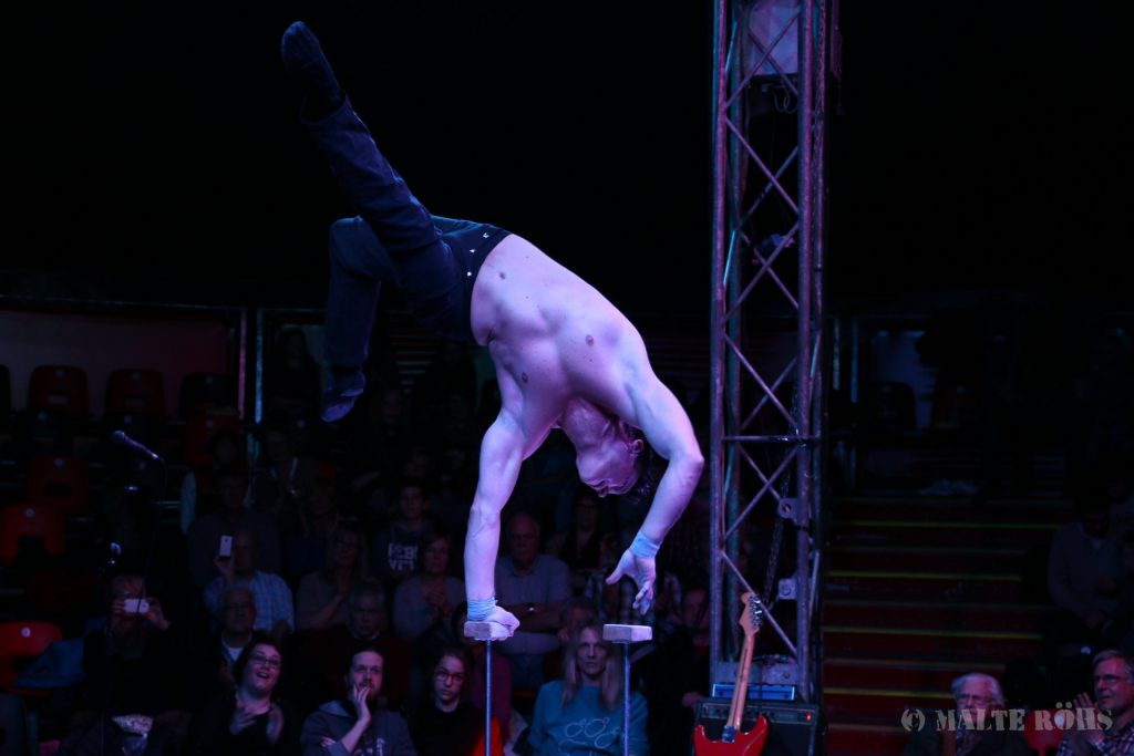 Man during an amazing acrobatic performance in a show of circus EigenArt