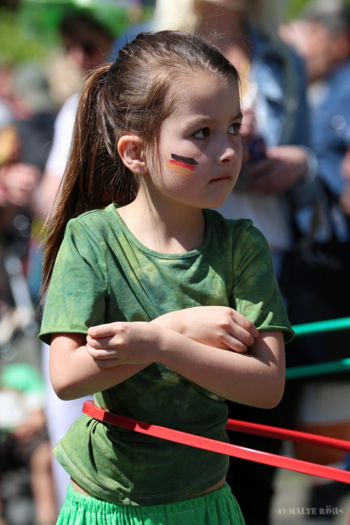 Child playing hula hoop during the Carnival der Kulturen 2015 in Bielefeld