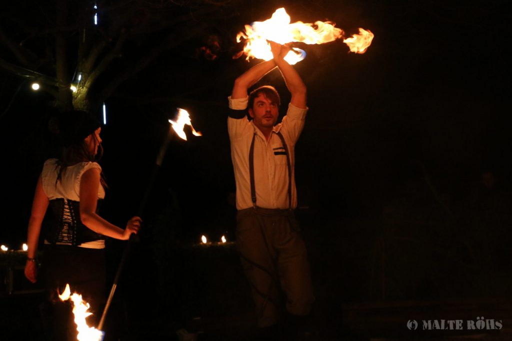 Sabine and Tim from Hot & Twisted during a performance with fire staffs