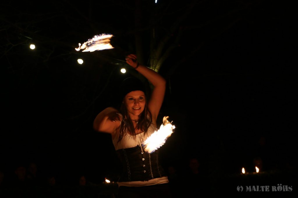 Sabine from Hot & Twisted during a performance with fire pois