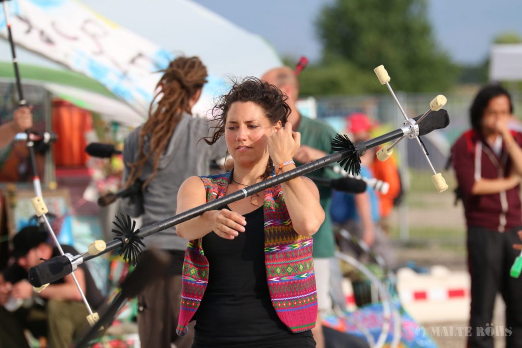 Woman playing a dragon staff during the European Juggling Convention (EJC) 2016 in Almere, Netherlands