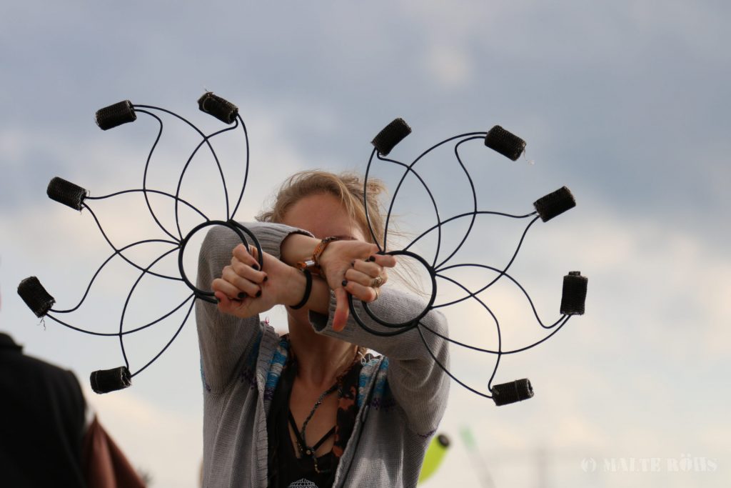 Woman playing a fire fan during the European Juggling Convention (EJC) 2016 in Almere, Netherlands