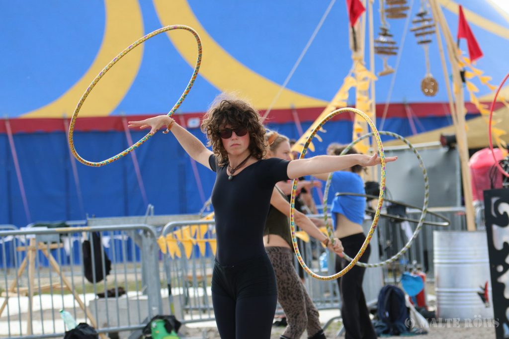 Woman playing two hula hoop during the European Juggling Convention (EJC) 2016 in Almere, Netherlands