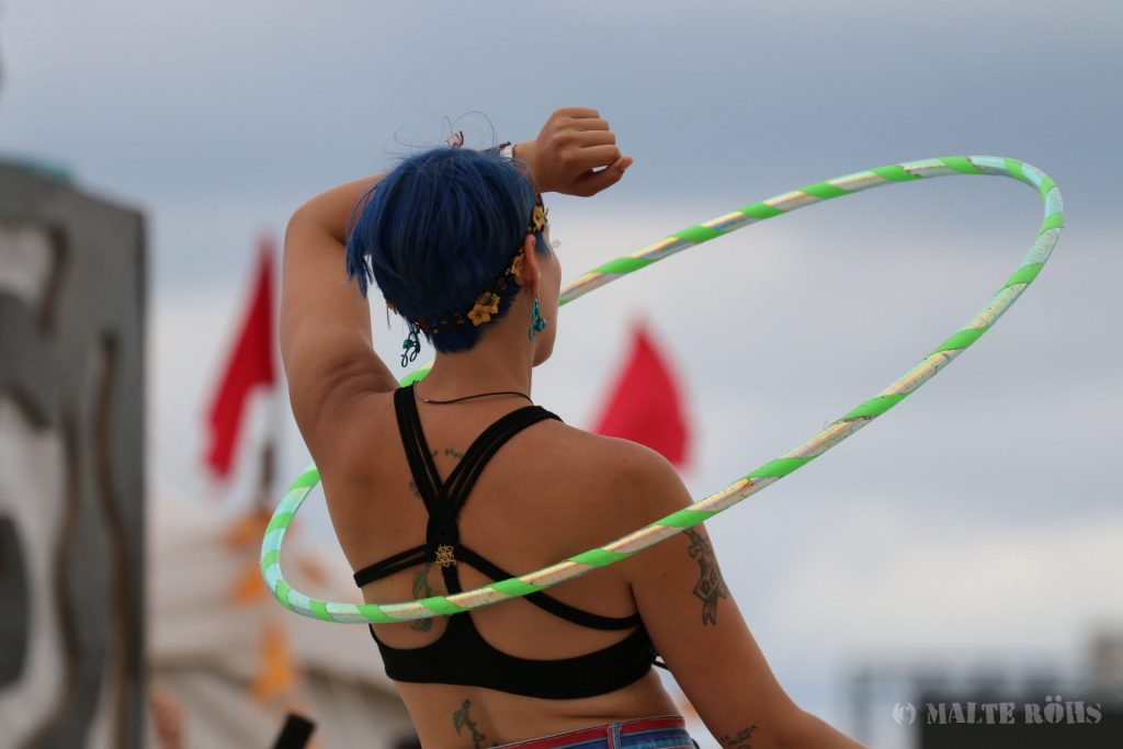 Woman playing hula hoop during the European Juggling Convention (EJC) 2016 in Almere, Netherlands