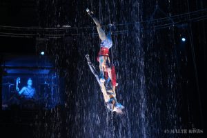 The Duo Turkeiev during an acrobatic air performance with artificial rain in the PUNXXX show of circus Flic Flac