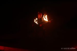 The Master of Hell Fire playing on a burning guitar during the PUNXXX show of circus Flic Flac